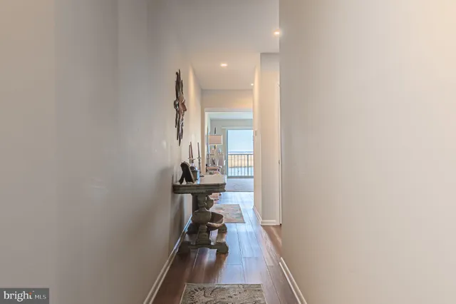 a view of a hallway with a white walls