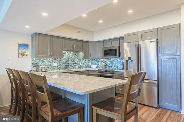a kitchen with a table and chairs in it
