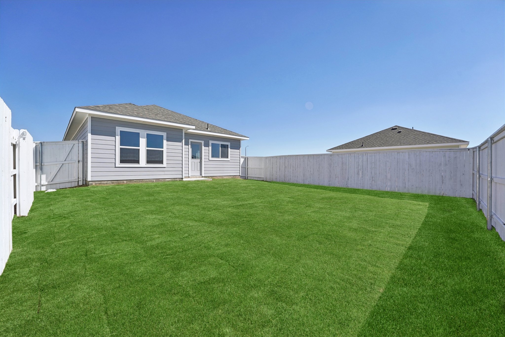 136 Summer Drive Elgin, TX 78621 - Photo 28 of 35 Rear of Home and Private Backyard