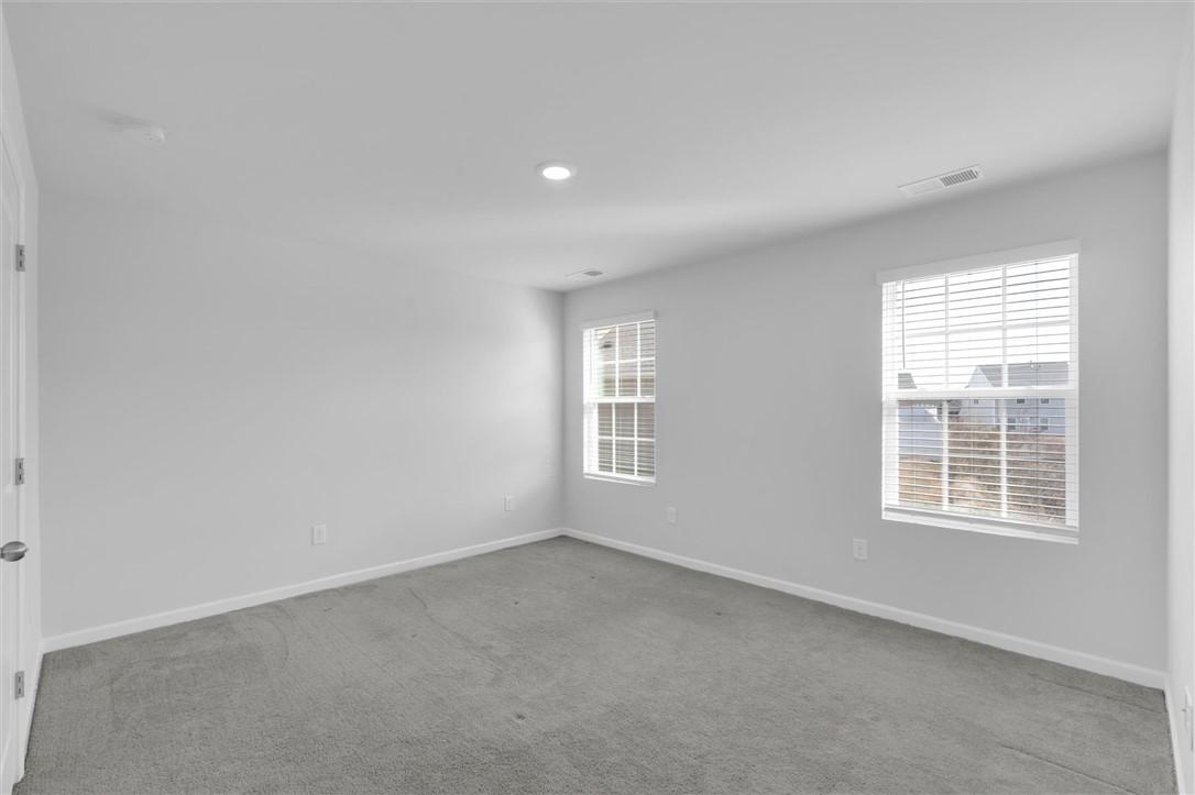515 Brasstown Court Pendleton, SC 29670 - Photo 10 of 25 This airy primary bedroom suite offers ample natural light, ideal for peaceful relaxation or productive pursuits.