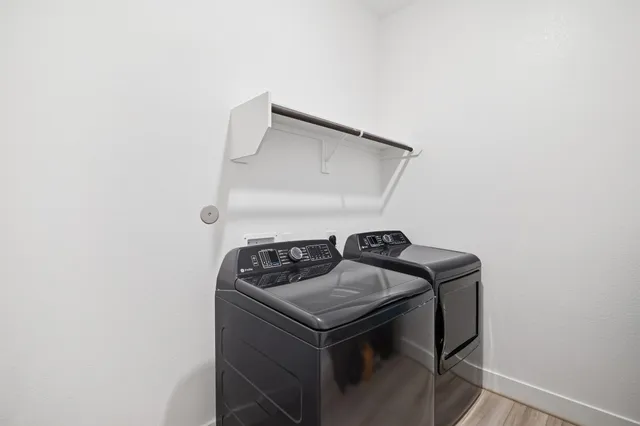 a utility room with washer and dryer