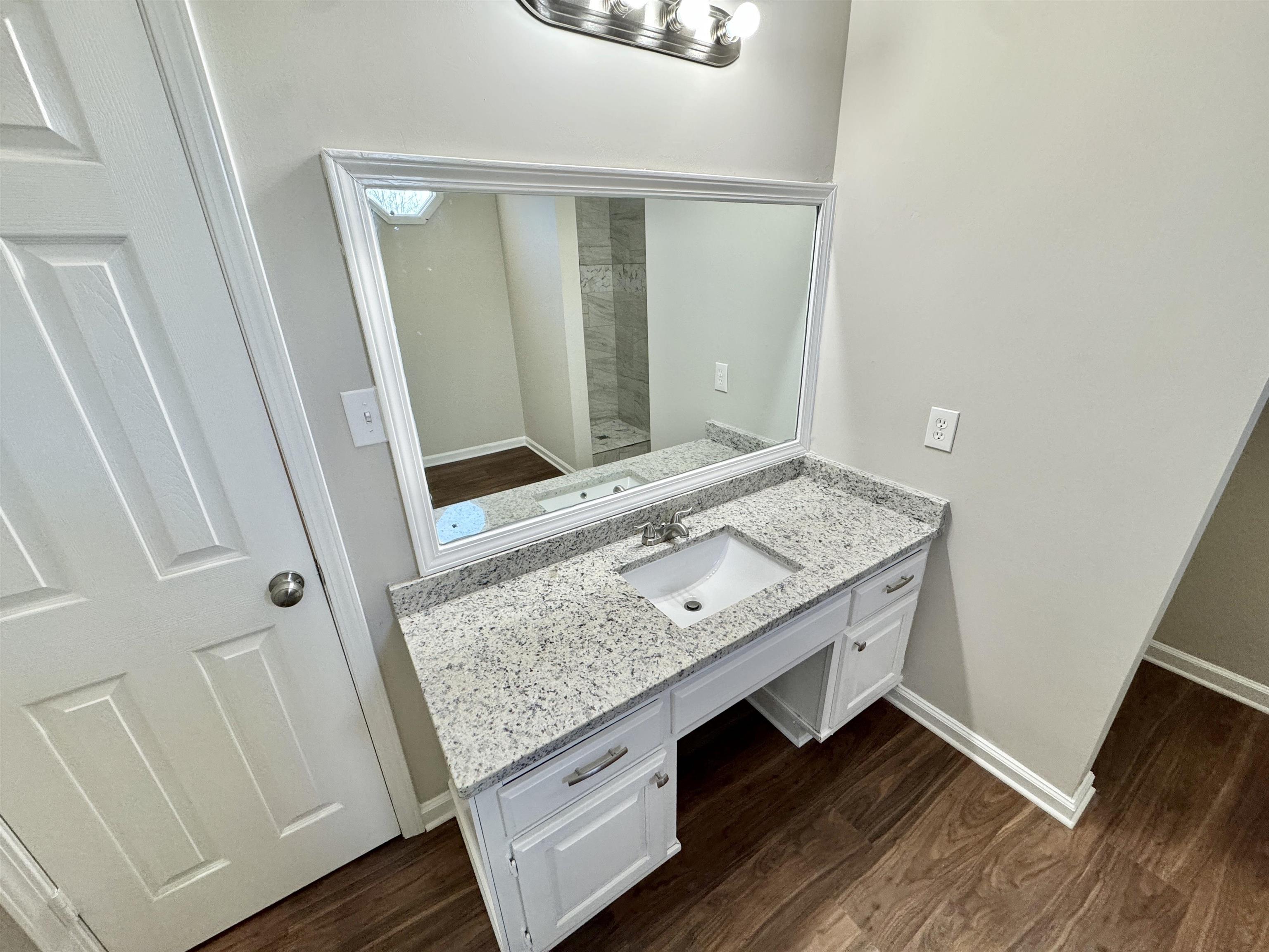 775 Portersville Road Atoka, TN 38004 - Photo 17 of 37 Bathroom with wood-type flooring and vanity