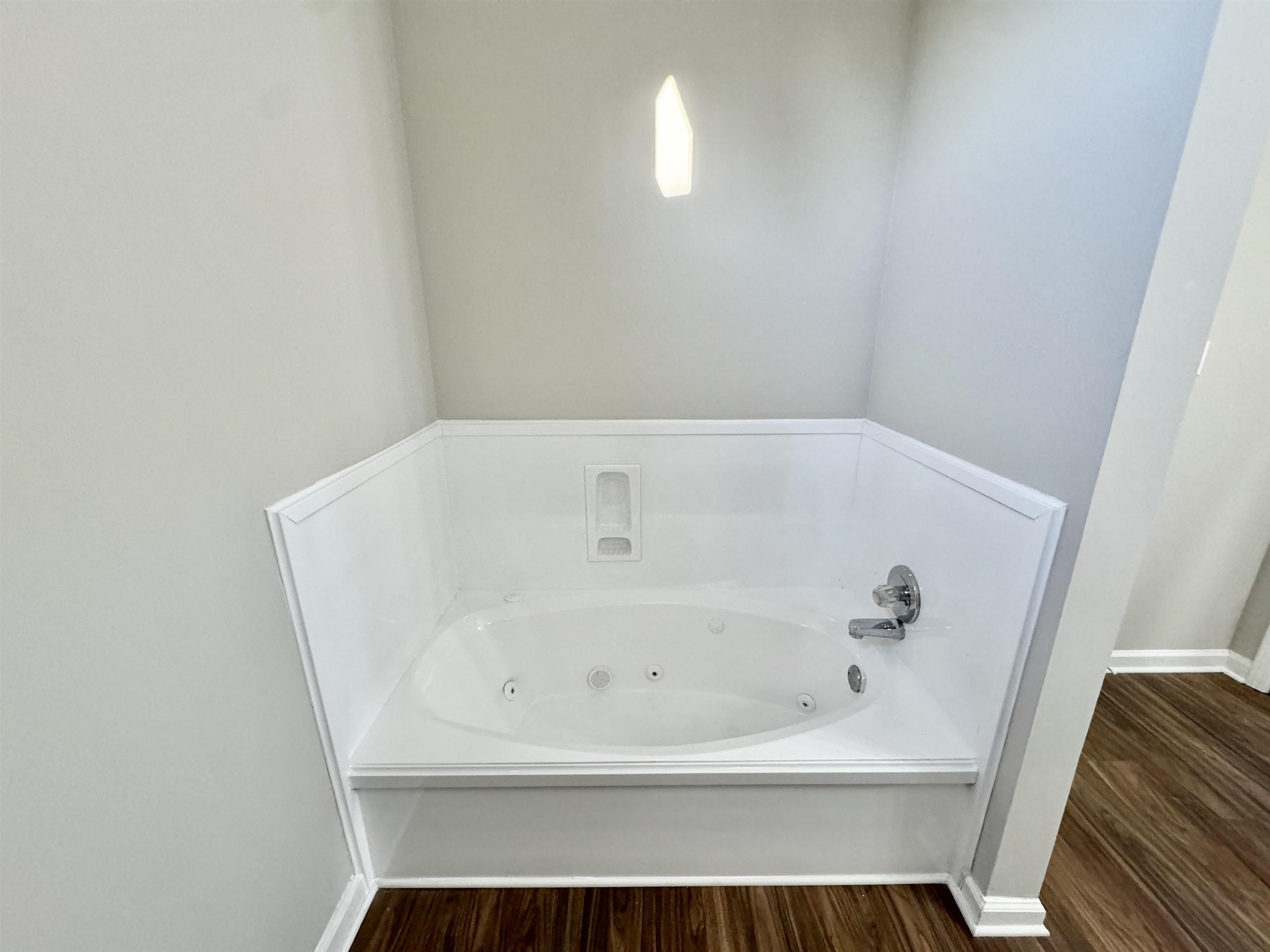 775 Portersville Road Atoka, TN 38004 - Photo 18 of 37 Bathroom with hardwood / wood-style flooring and a bathing tub