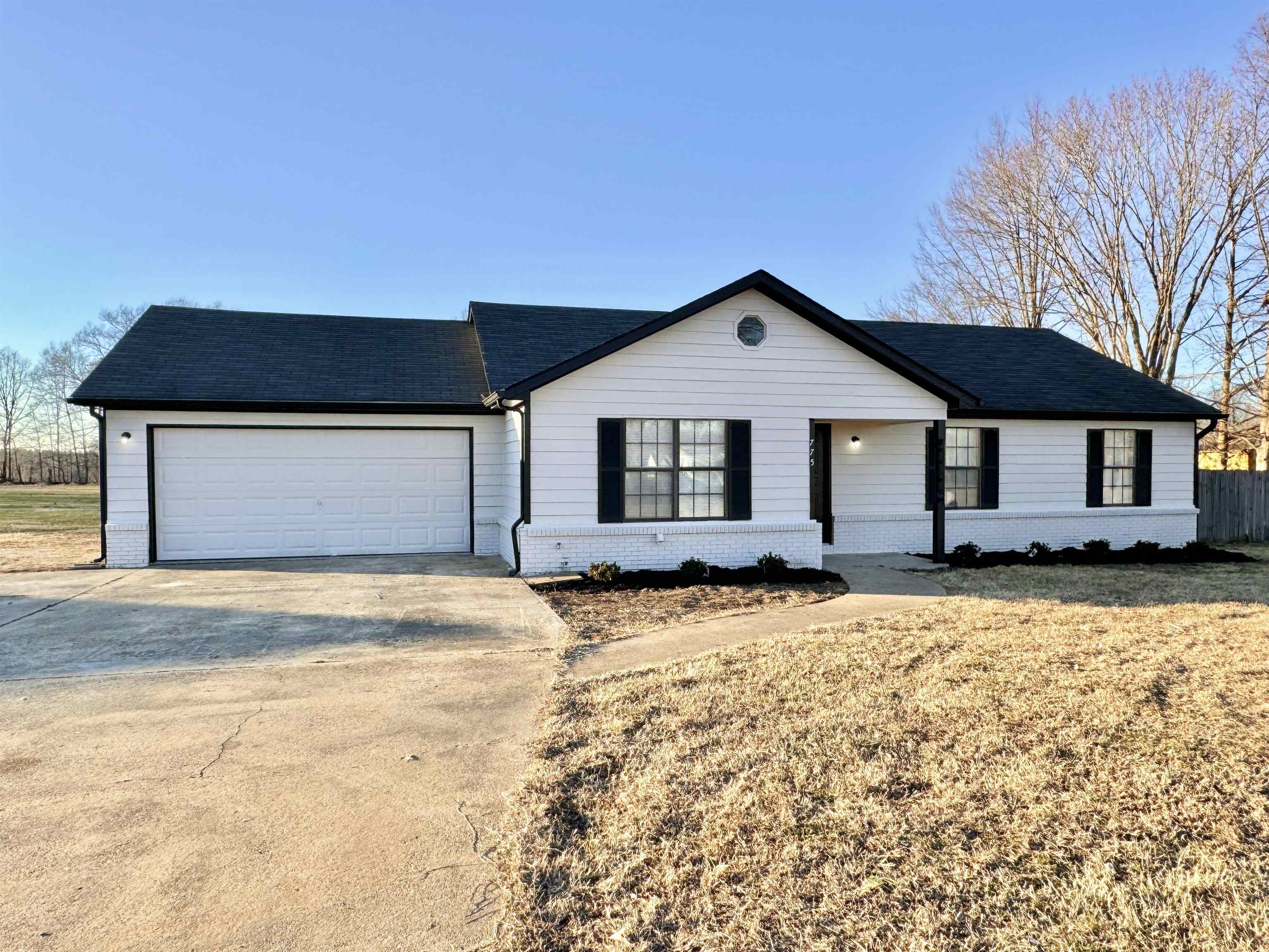 Ranch-style home featuring a garage