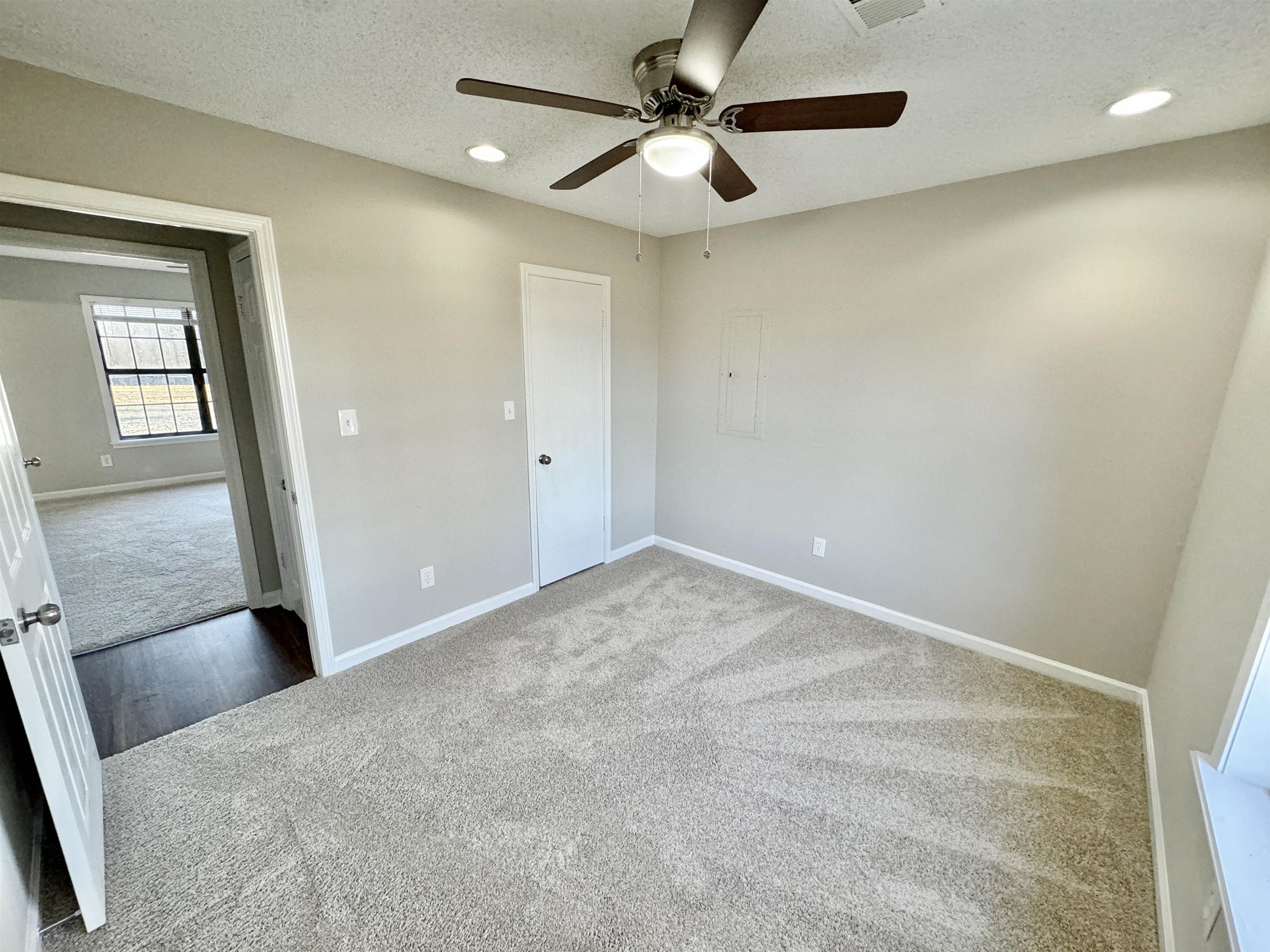 775 Portersville Road Atoka, TN 38004 - Photo 24 of 37 Carpeted spare room featuring ceiling fan and a textured ceiling