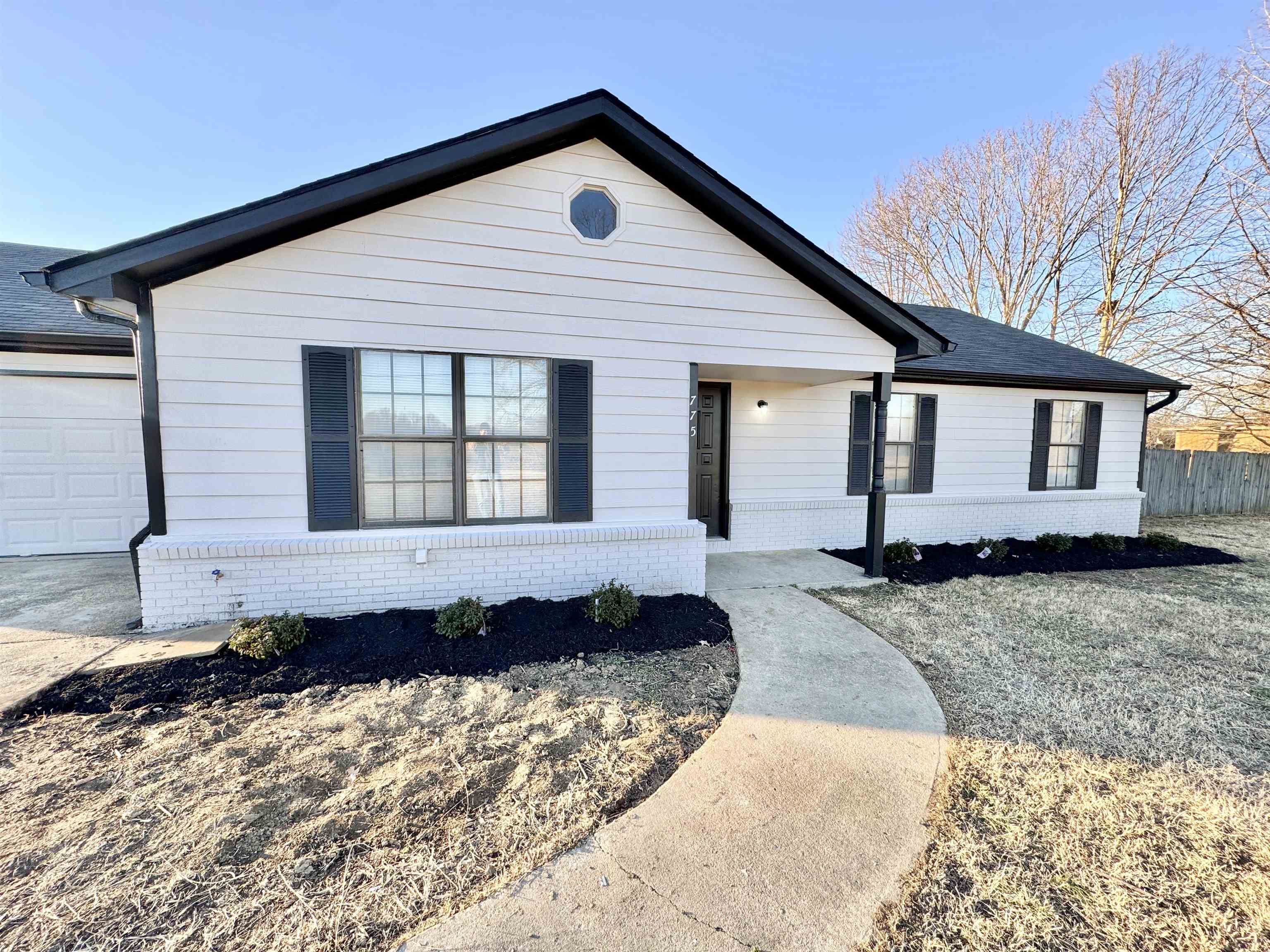 View of front of home featuring a garage