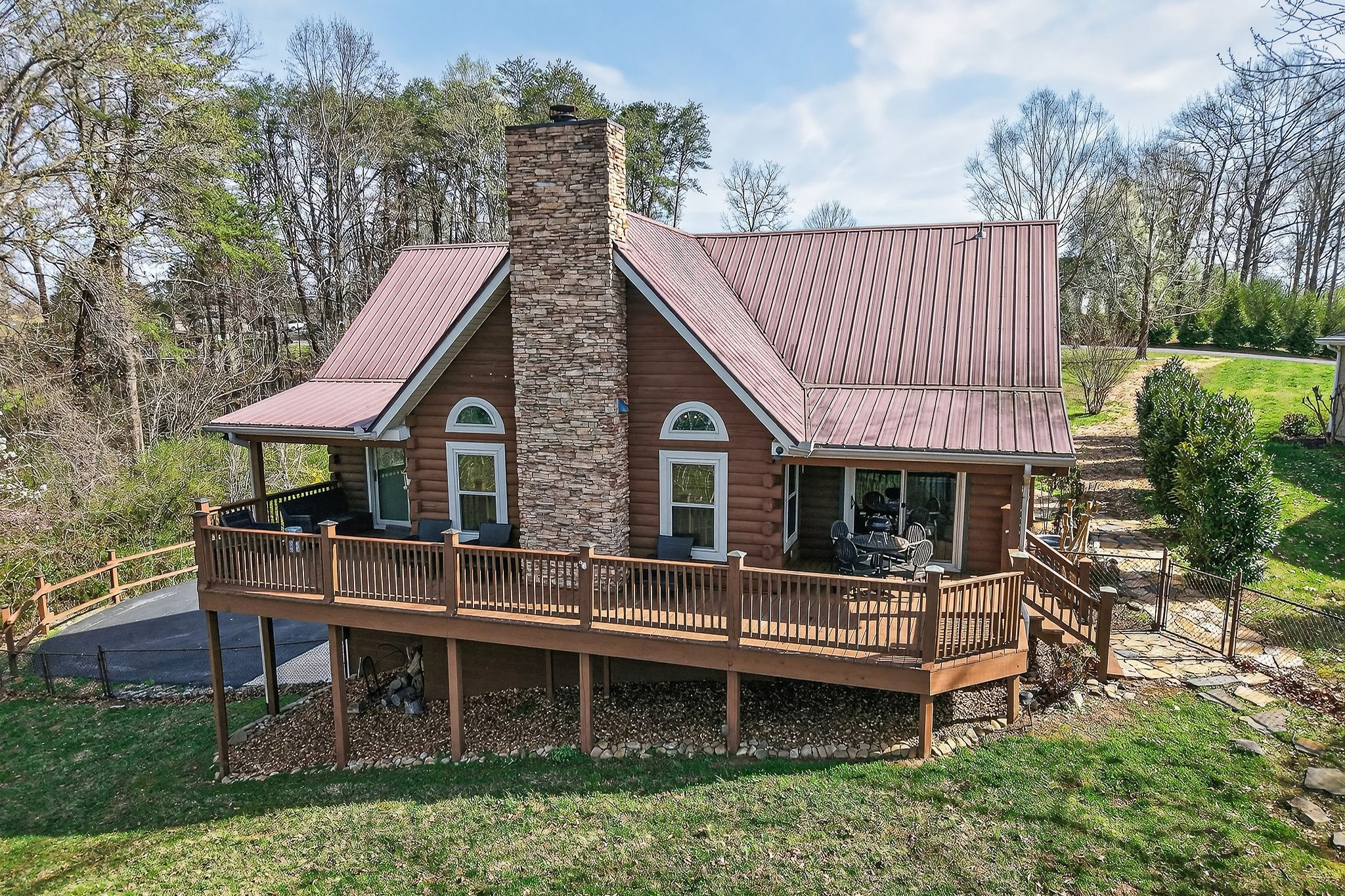 142 Rayahs Way Quebeck, TN 38579 - Photo 60 of 73 a backyard of a house with table and chairs