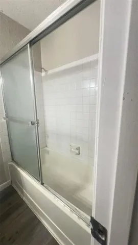 an empty room with wooden floor