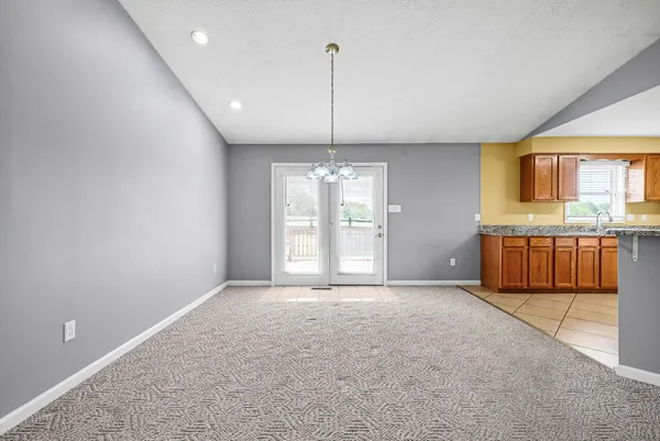 a view of a kitchen with a sink and cabinets