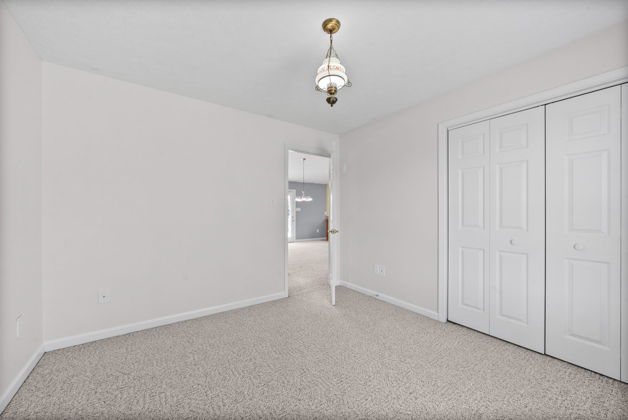 5005 Harmony Grove Road Hopkinsville, KY 42240 - Photo 19 of 41 a view of an empty room and chandelier fan