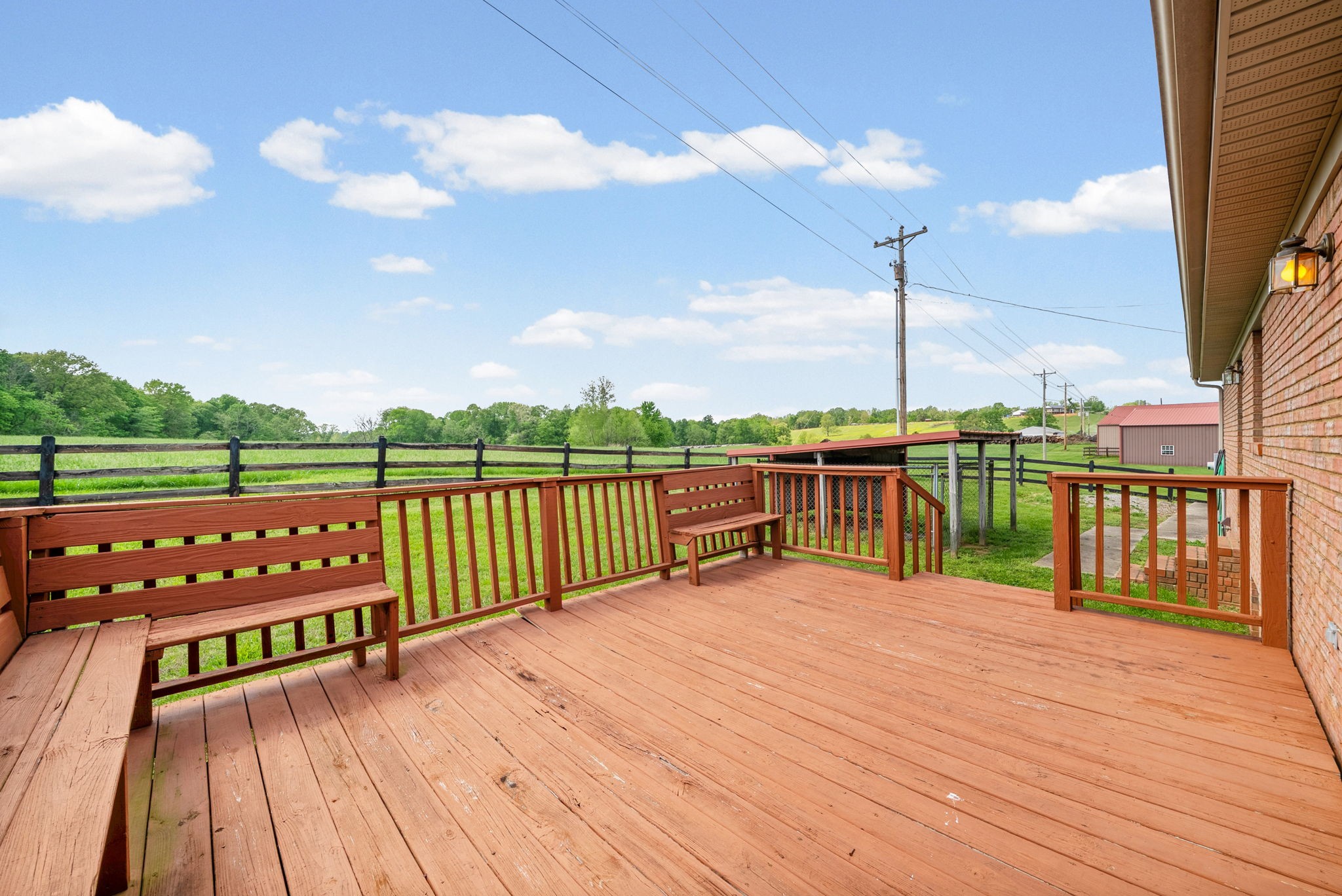 5005 Harmony Grove Road Hopkinsville, KY 42240 - Photo 32 of 41 a view of building with balcony and wooden floor