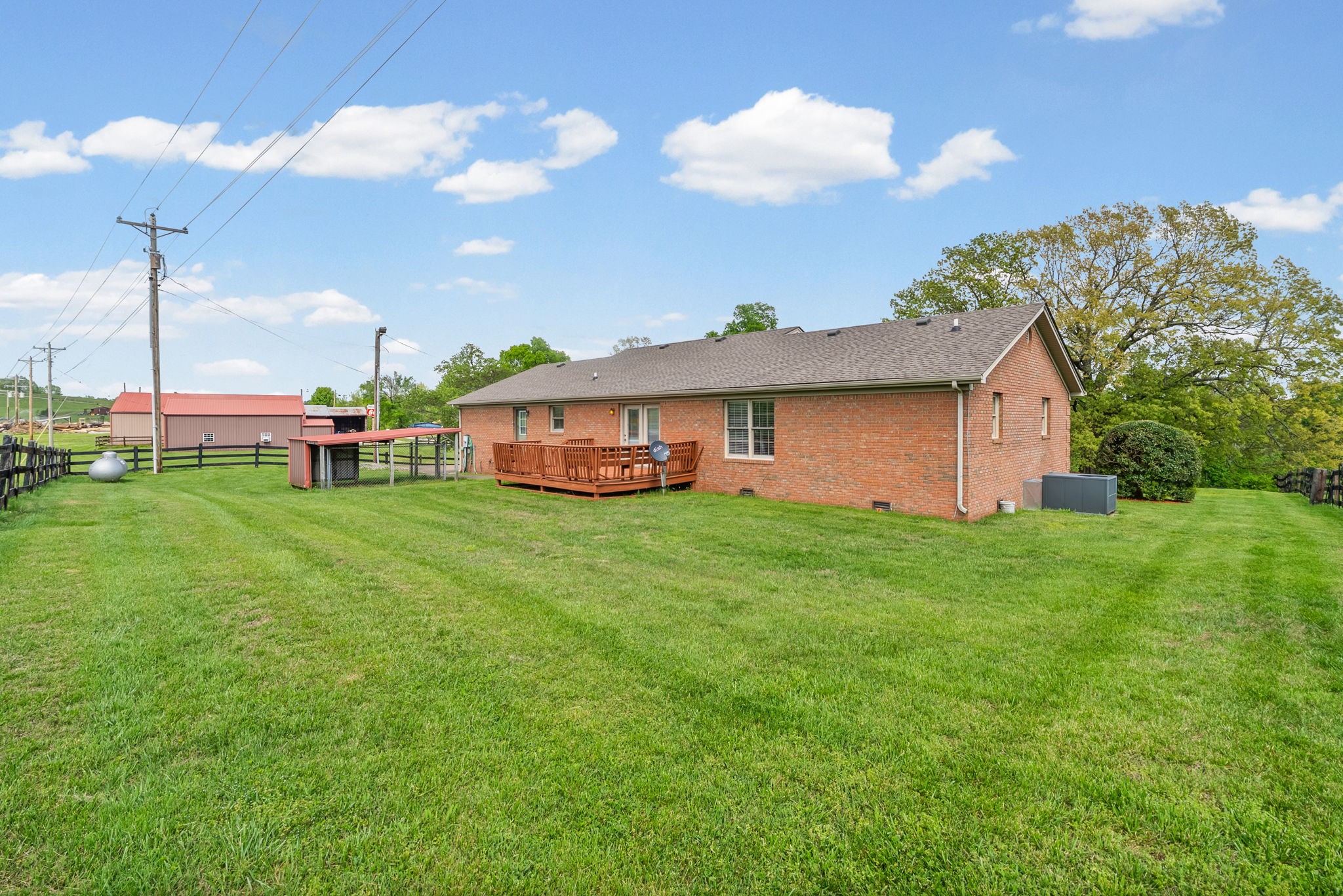 5005 Harmony Grove Road Hopkinsville, KY 42240 - Photo 33 of 41 a view of a house with a backyard