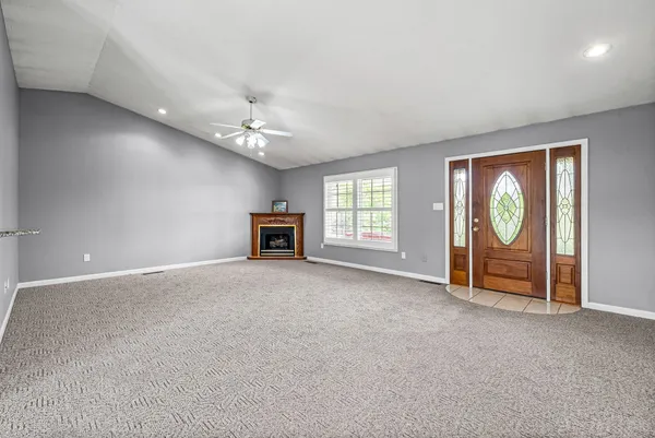 a view of an empty room with a window