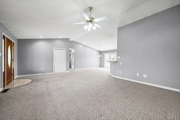 a view of an empty room with a window
