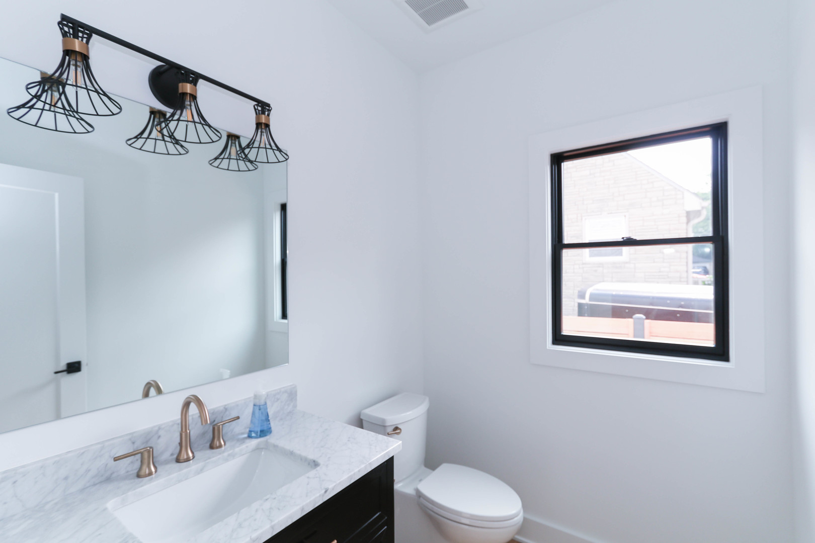 26205 Stewart Ridge Drive Plainfield, IL 60585 - Photo 16 of 28 a bathroom with a toilet sink and mirror