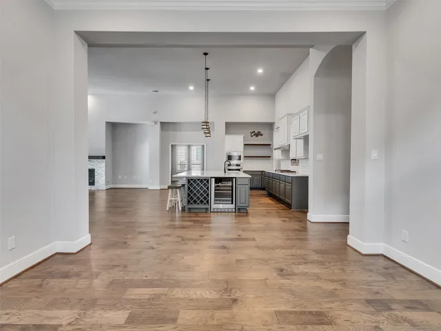 a kitchen with stainless steel appliances a refrigerator and a stove top oven