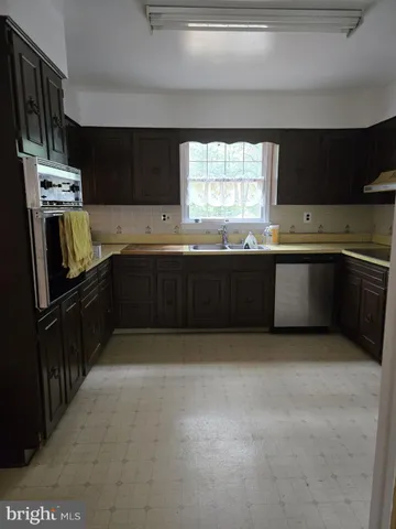 a large kitchen with a large window