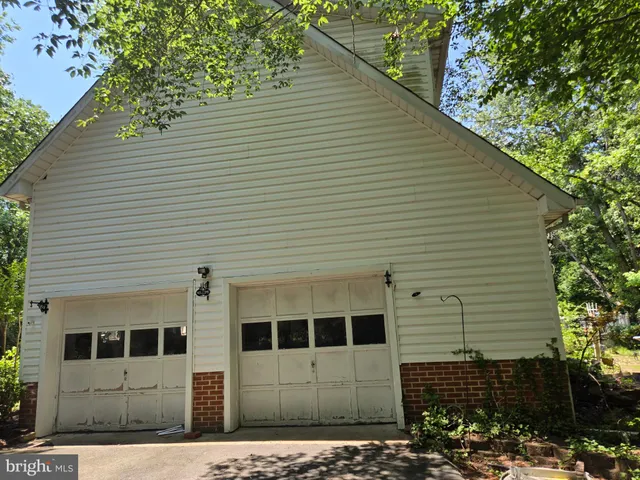 a view of a house with a tree