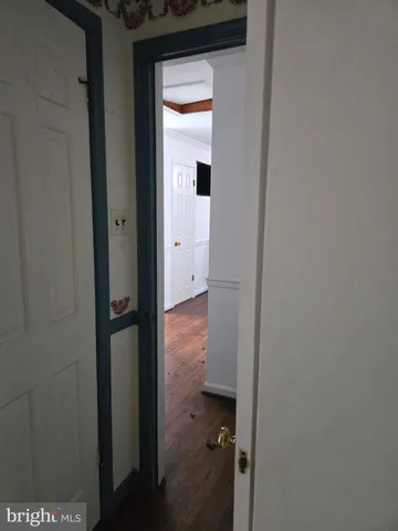 a view of a bathroom from a hallway