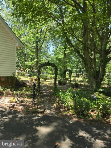 a view of a water fountain in the back yard