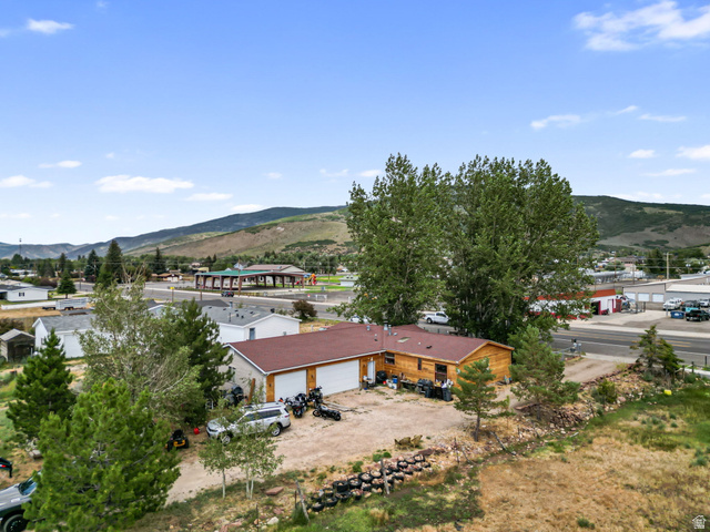 490 South Main Street Kamas, UT 84036 - Photo 18 of 25 Single-story residence featuring a brown shingle roof and wood siding
