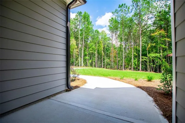a kitchen with stainless steel appliances a stove microwave and sink