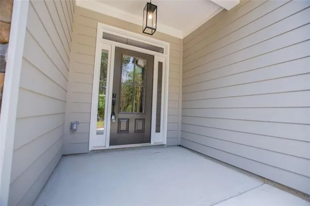 a view of a kitchen with wooden floor and a fireplace