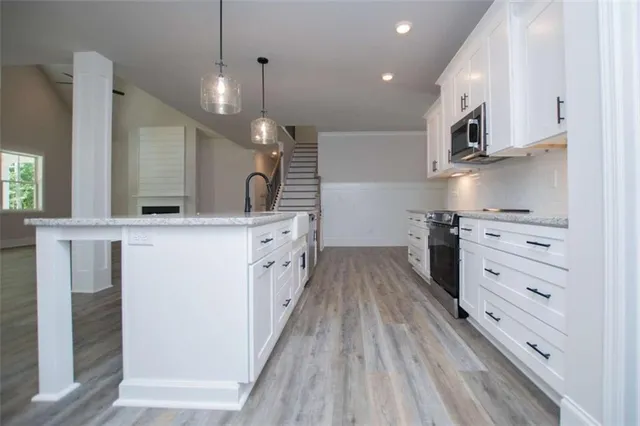 an empty room with a ceiling fan and carpet