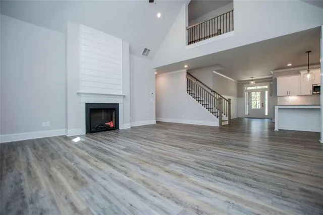 a view of an empty room with a closet
