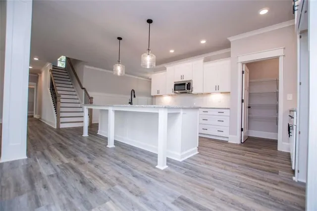 a view of an empty room and closet area