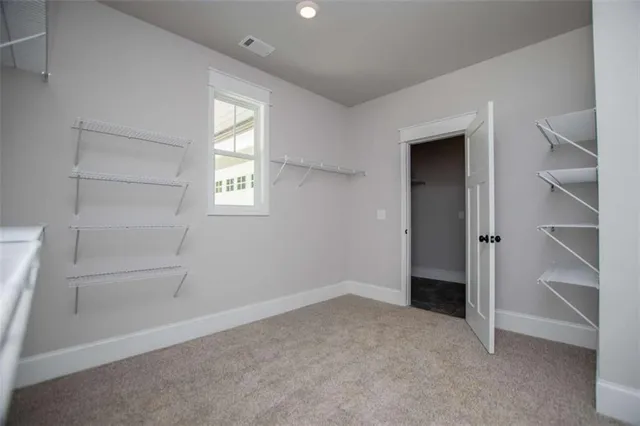 a view of a house with a backyard and a patio