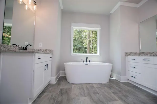 an aerial view of a house with garden space and street view