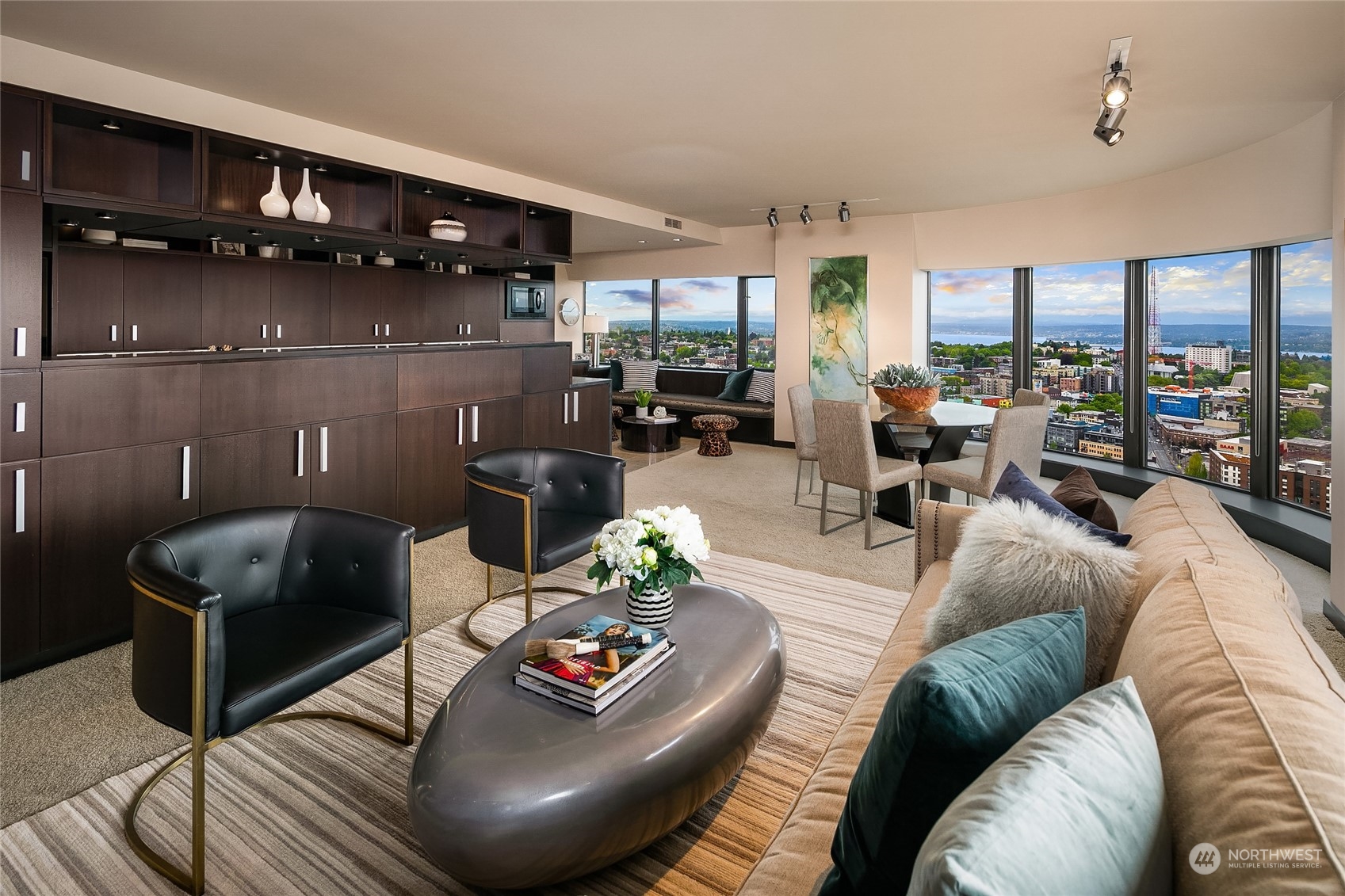 1301 Spring Street, Unit 29H Seattle, WA 98104 - Photo 1 of 29 a living room with furniture and a floor to ceiling window