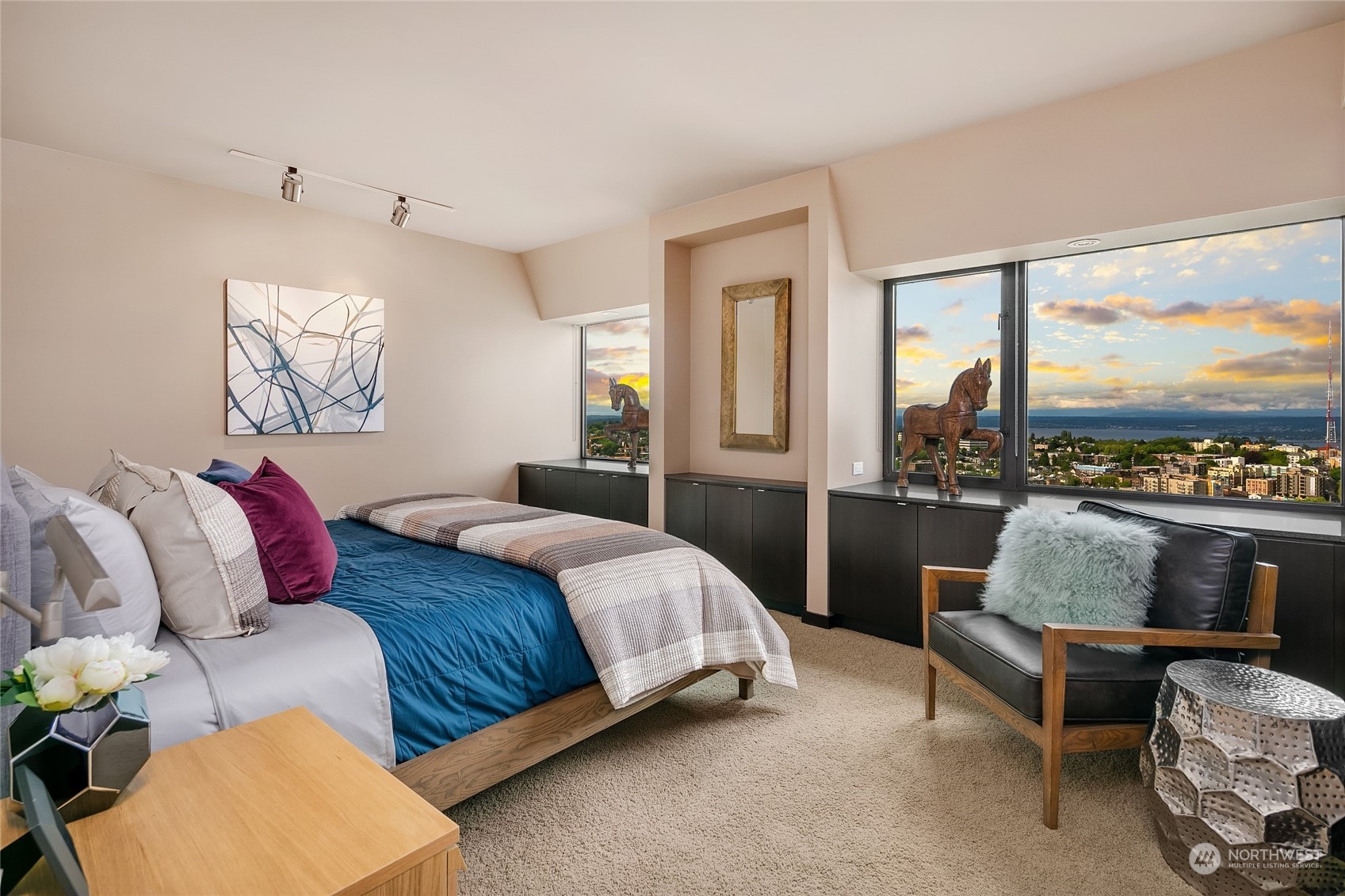 1301 Spring Street, Unit 29H Seattle, WA 98104 - Photo 11 of 29 a bedroom with a bed and glass window