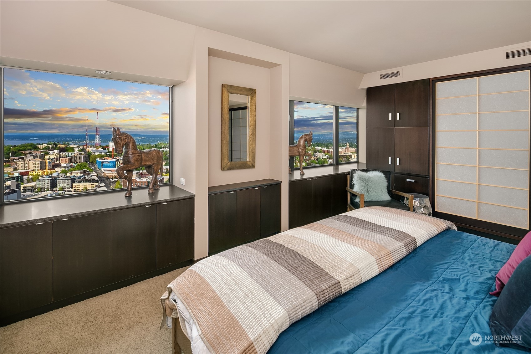 1301 Spring Street, Unit 29H Seattle, WA 98104 - Photo 12 of 29 a bedroom with a bed and window