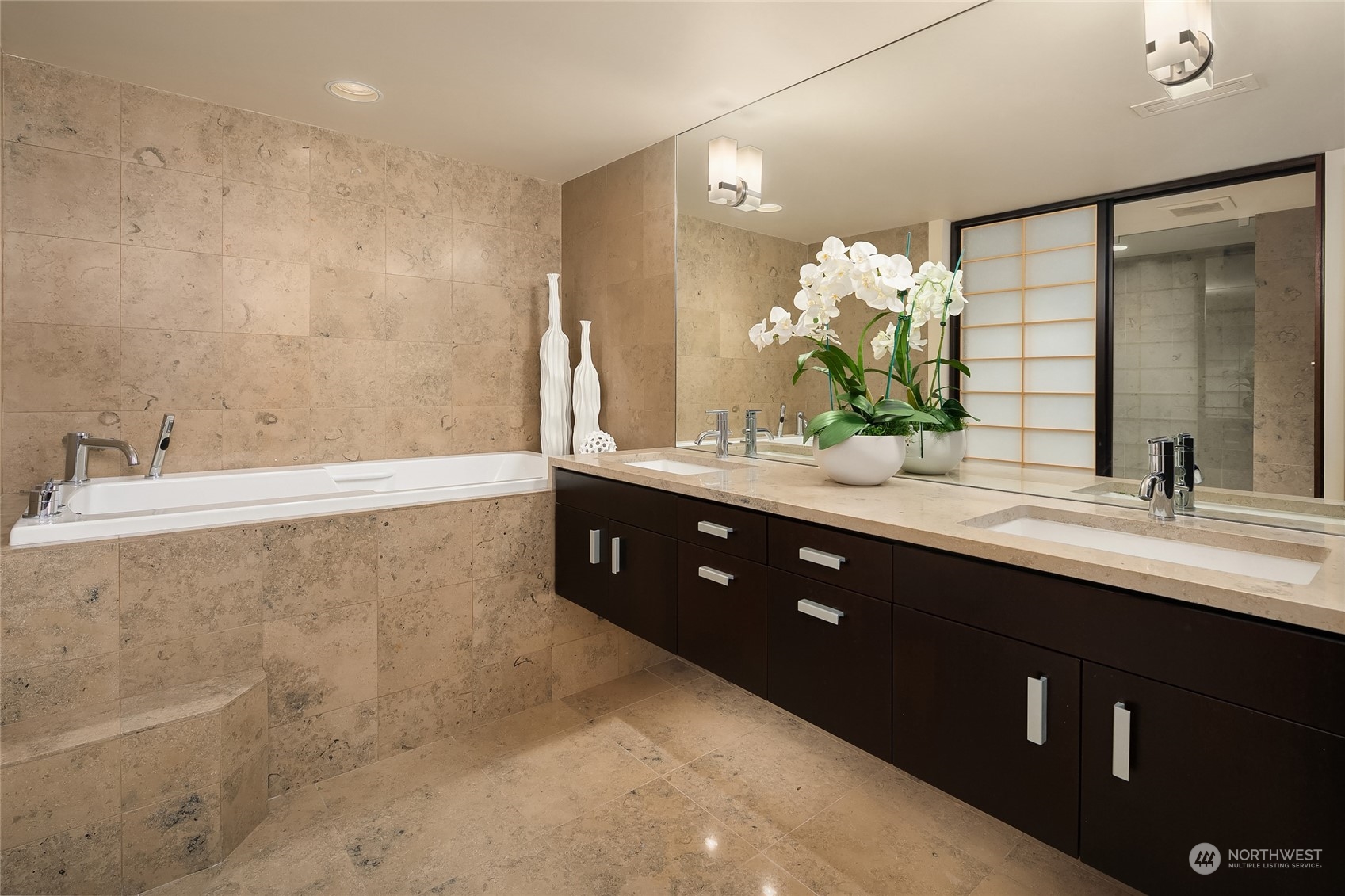 1301 Spring Street, Unit 29H Seattle, WA 98104 - Photo 14 of 29 a bathroom with a double vanity sink and a mirror