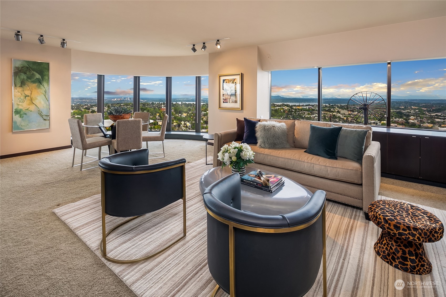 1301 Spring Street, Unit 29H Seattle, WA 98104 - Photo 2 of 29 a living room with furniture and a view of kitchen