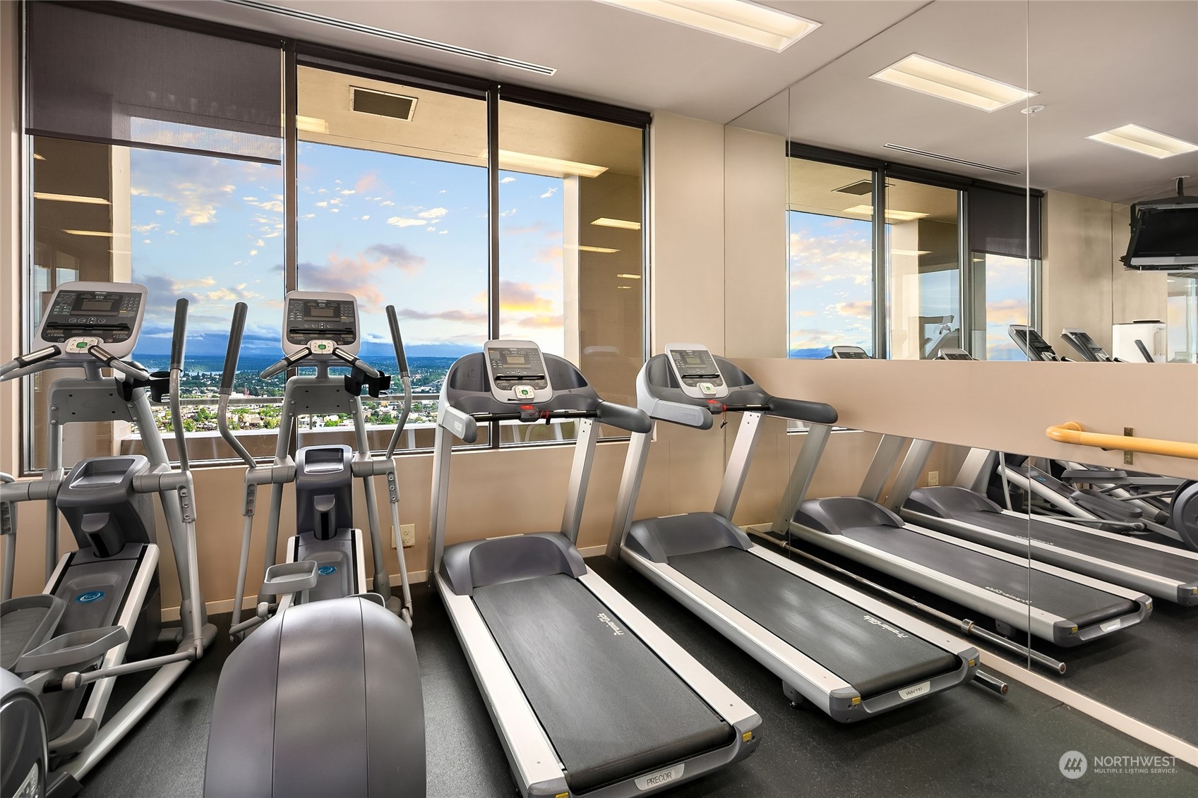 1301 Spring Street, Unit 29H Seattle, WA 98104 - Photo 28 of 29 a room with gym equipment and a large window