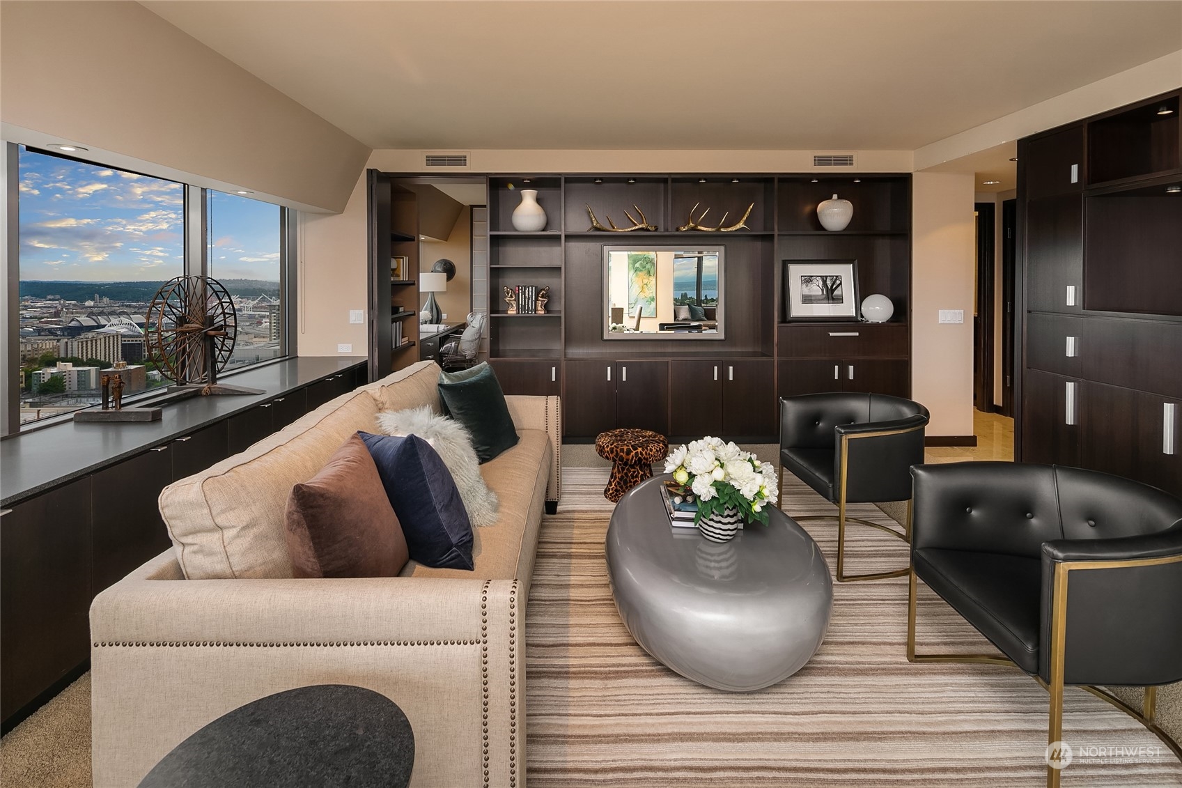 1301 Spring Street, Unit 29H Seattle, WA 98104 - Photo 3 of 29 a living room with furniture and a potted plant