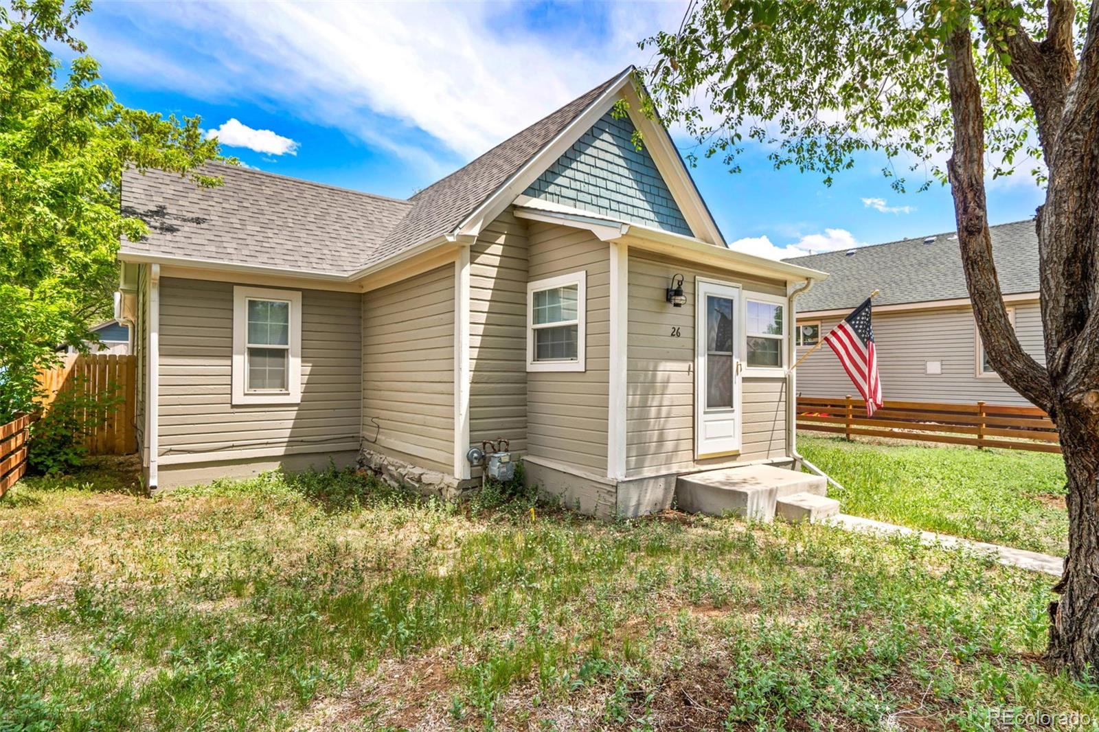 26 Main Street Windsor, CO 80550 - Photo 1 of 14 a view of backyard of house