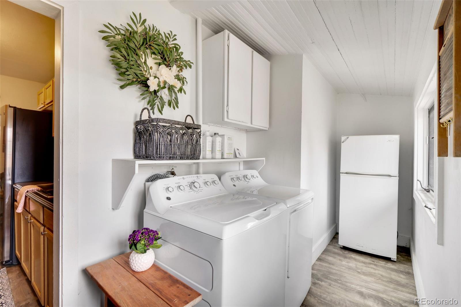 26 Main Street Windsor, CO 80550 - Photo 12 of 14 a utility room with washer and dryer