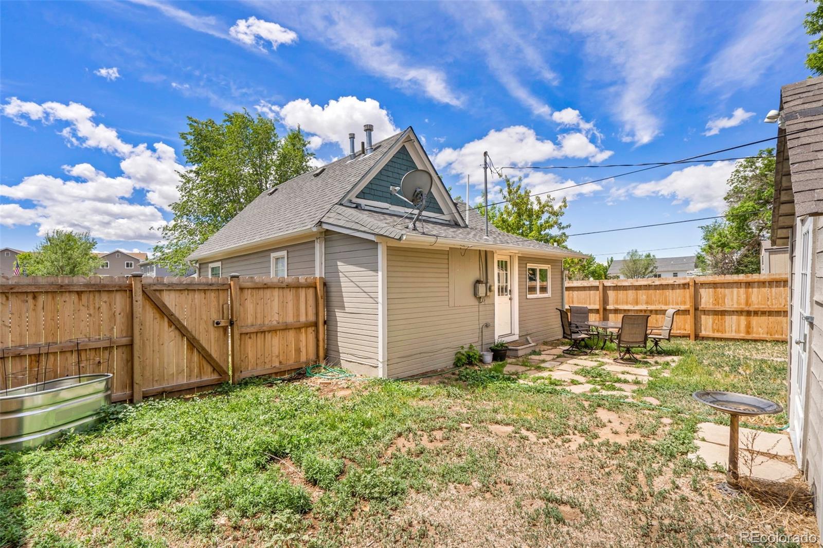 26 Main Street Windsor, CO 80550 - Photo 14 of 14 a house view with a garden space