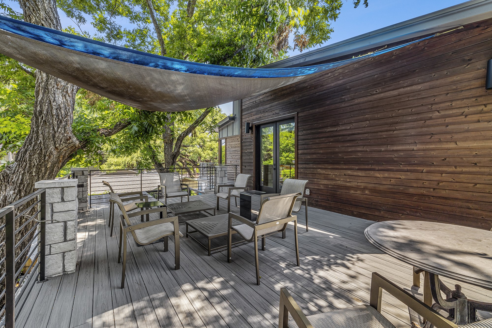 2414 Kinney Road Austin, TX 78704 - Photo 24 of 40 a view of a patio with table and chairs and wooden floor