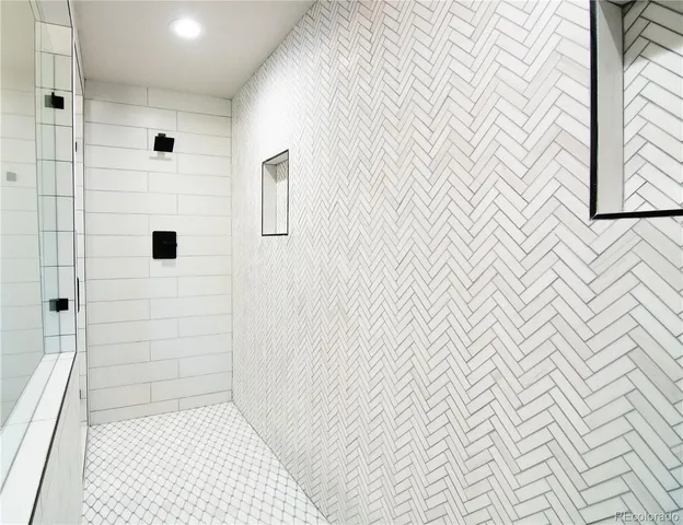 a kitchen with cabinets appliances and a sink