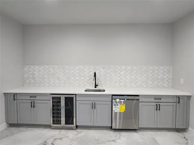 a bathroom with a double vanity sink toilet and shower