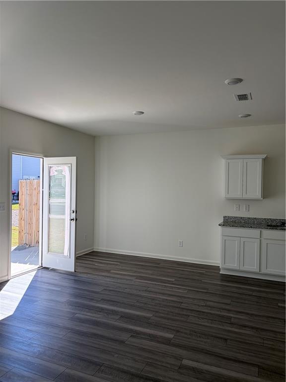 3512 Condor Court Atlanta, GA 30331 - Photo 18 of 19 an empty room with wooden floor and windows