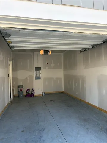 a view of a room with wooden floor and a window
