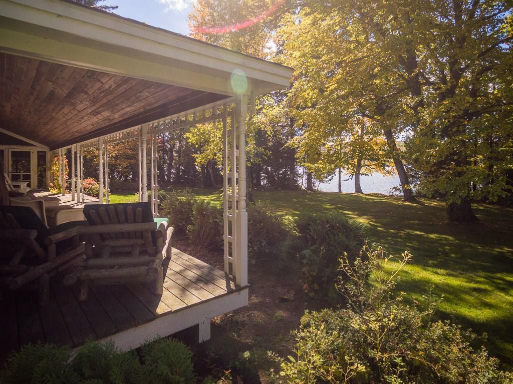 17 Burr Road Rangeley, ME 04970 - Photo 22 of 35 View of the covered porch and back lawn