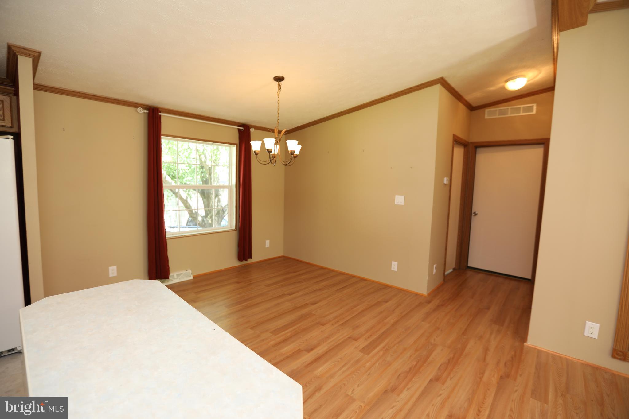 2439 Fairmount Road, Unit 11 Hampstead, MD 21074 - Photo 8 of 29 a view of a bedroom with a natural light