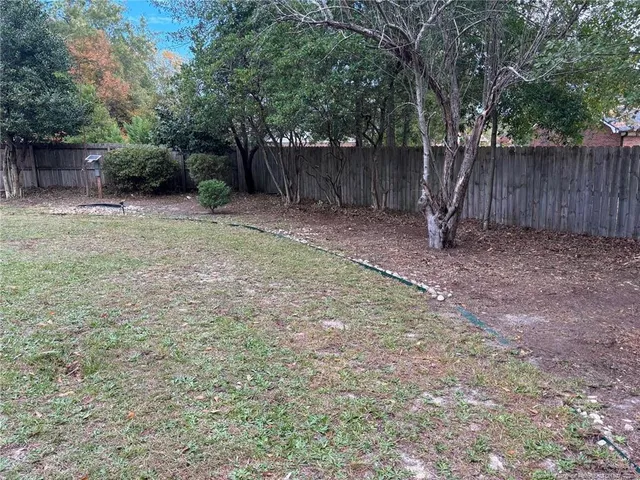 a backyard of a house with lots of green space